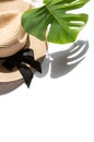 Summer flat lay template Straw hat monstera leaf shadow