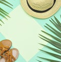Summer flatlay . Hat, palm tree leaf.