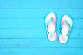 Summer flip flops on a blue wood background, top view with copy space Royalty Free Stock Photo