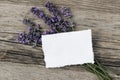 Summer floral stationery still life scene. Blank greeting card mock-up on old wooden table background with lavender Royalty Free Stock Photo