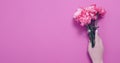 Summer flowers composition with girl hand isolated on pink background. Mother and women day. Valentine holidays concept. Top view Royalty Free Stock Photo