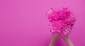 Summer flowers composition with girl hand isolated on pink background. Mother and women day. Valentine holidays concept. Top view Royalty Free Stock Photo