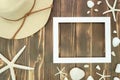Summer Frame Mockup With Starfish And Seashells. Straw Hat And Beach Flip Flops On Wooden Planks Background. Copy Space