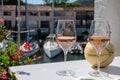 Summer on French Riviera Cote d`Azur, cold rose wine from Cotes de Provence on outdoor terrase in Port Grimaud, Var, Royalty Free Stock Photo