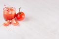 Summer fresh drink - cold alcoholic cocktail bloody Mary - pulpy red tomato juice on light white wooden board, copy space. Royalty Free Stock Photo