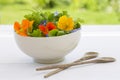 Summer fresh flowers salad in bowl Royalty Free Stock Photo