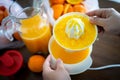 Summer fresh orange fruit getting squeezed Royalty Free Stock Photo