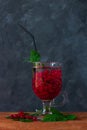 Summer fresh red currant ice tea in glass on dark background. Seasonal vitamins healthy food. Easy homemade recipe photo Royalty Free Stock Photo