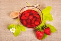 Fresh red strawberry and jam on textile background Royalty Free Stock Photo