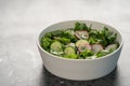 Summer fresh salad with radish, cucumber and herbs in white bowl Royalty Free Stock Photo