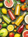 Summer fruit drinks. Citrus juices and smoothies in bottles, food background, top view. Mix of different whole and cut fruits: