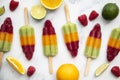 Summer fruit ice lollies made with orange lime and raspberries Royalty Free Stock Photo