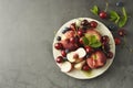 Summer fruit mix - cherry, blueberry, peach. Fruit salad plate. Flat lay with copy space Royalty Free Stock Photo