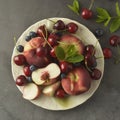 Summer fruit mix - cherry, blueberry, peach. Fruit salad plate. Square image Royalty Free Stock Photo