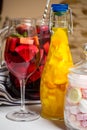 Summer fruit painted cocktails, lemonade, wine in glass, studio photo