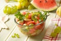 Summer fruit salad in the glass bowl - watermelon, peach, grapes