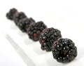 Summer fruit salad ingredients, blackberries in a line Royalty Free Stock Photo