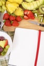 Summer fruit salad, kitchen board, cookbook, copy space Royalty Free Stock Photo