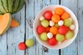 Summer fruit salad with melon and cheese, overhead scene on blue wood Royalty Free Stock Photo