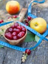 Summer fruit and tape measure Royalty Free Stock Photo