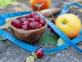 Summer fruit and tape measure Royalty Free Stock Photo