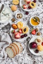 Summer fruits - apricots, peaches, plums, cherries, strawberries and blue cheese, honey, walnuts on a light stone background. Heal Royalty Free Stock Photo