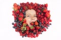 Summer fruits. Berries child face close up. Top view photo of child face with berri. Berry set near kids face. Cute Royalty Free Stock Photo