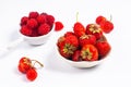 Summer fruits concept strawberry and rasberry in ceramic cup on