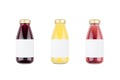 Summer fruits juices - orange juice, strawberry, currant in glass bottles with blank label isolated, mock up for design. Royalty Free Stock Photo