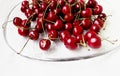 Summer fruits, red cherries on a glass plate Royalty Free Stock Photo