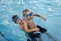 Summer fun, boys playing in swimming pool Royalty Free Stock Photo