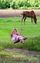 Summer fun, girl on a wood swing Royalty Free Stock Photo