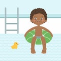 Summer fun. Happy little black boy swimming on an inflatable lap in the pool. Royalty Free Stock Photo