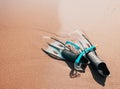 summer fun and snorkeling fins in the sand Royalty Free Stock Photo