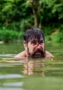 Summer fun. water beast. furry monster. wild man. time to relax. bearded man swimming in lake. summer vacation. mature Royalty Free Stock Photo