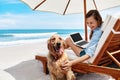 Summer Fun. Woman Using Laptop, Relaxing By Sea. Summertime Vacations Royalty Free Stock Photo
