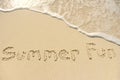 Summer Fun Written in Sand on Beach Royalty Free Stock Photo