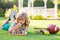 Summer games and outdoor activities for kids. Concentrated child boy developing chess strategy, playing board game in Royalty Free Stock Photo