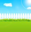 Summer garden scene with wooden fence and blue sky - Useful as b