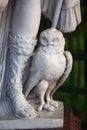 Summer Garden, St. Petersburg. An owl at the feet of the goddess Minerva, close-up. Fragment of a marble statue, late 17th century Royalty Free Stock Photo