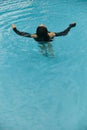 summer getaway, carefree brunette woman swimming Royalty Free Stock Photo