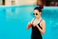 Summer Girl Applying Suncream Lotion by the Pool Royalty Free Stock Photo