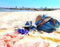 Summer  Girl beach clothes  Holiday vacation on tropical island sun blue sky blue handbag yellow towel cup of coffee seashell and Royalty Free Stock Photo