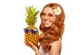 Summer girl Bright woman with a pineapple in her hands with earrings in the form of a tropical leaf, with sun glasses on a white