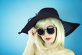 Summer girl, Glamor stylish beautiful young woman model with red lips and hipster sunglasses. Royalty Free Stock Photo