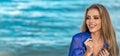 Summer girl. Happy smiling girl at sea during summer vacation. Beautiful young woman at summer beach. Portrait of Royalty Free Stock Photo