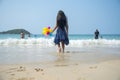 Summer girl play travel in holiday on tropical summer beach. Cheerful Joyful seaside with cute kid vacation on sunny day Royalty Free Stock Photo