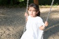 summer girl playing on swing set park outdoor Royalty Free Stock Photo