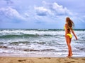 Summer girl sea in yellow swimsuit Royalty Free Stock Photo
