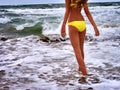 Summer girl sea in yellow swimsuit Royalty Free Stock Photo